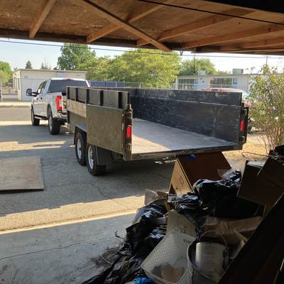 Branded trailer parked on a commercial job site in West Hills